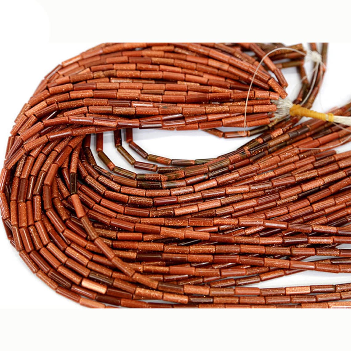 Perles tubulaires en grès doré 4x13 mm