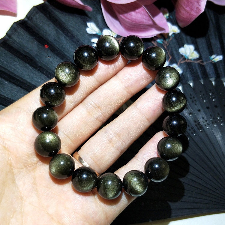 A Gold Obsidian Bracelet 8''
