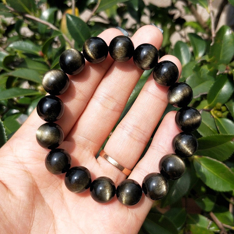 A Gold Obsidian Bracelet 8''